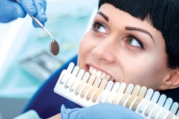 Woman at dental exam for tooth colored fillings in Winston Salem NC