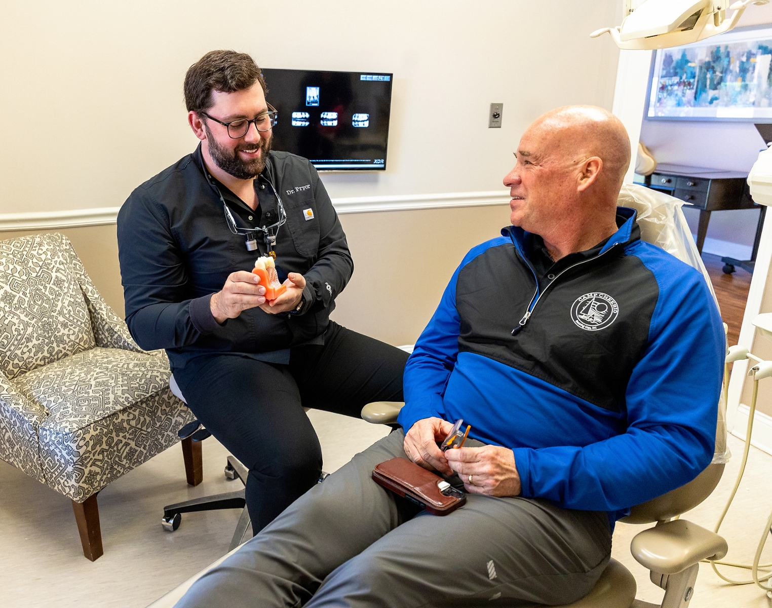 Dr. Pryor discussing root canals to a patient in Winston-Salem, NC