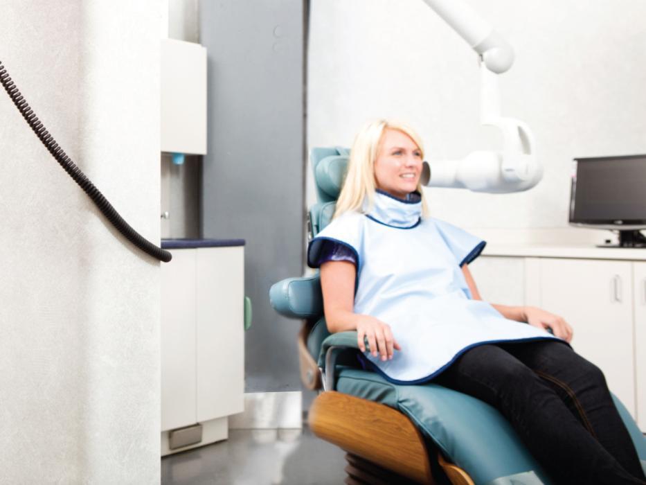 Woman in treatment chair for dental exam in Winston Salem NC