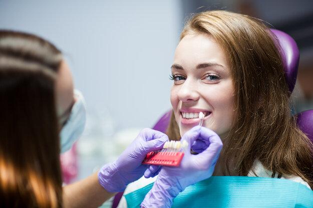 woman getting teeth whitening in winston-salem