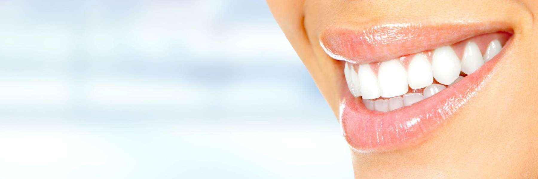 womans lips with white teeth