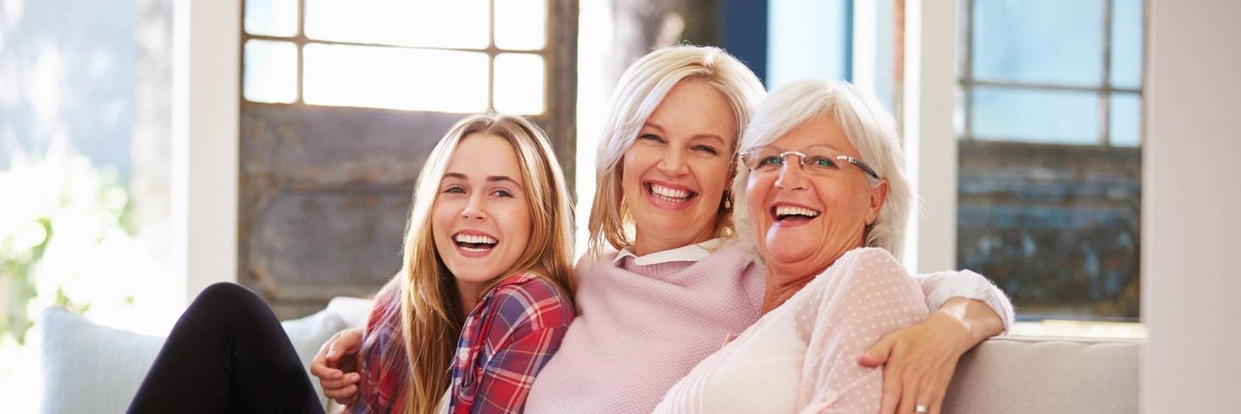 mother grandmother and daughter smiling