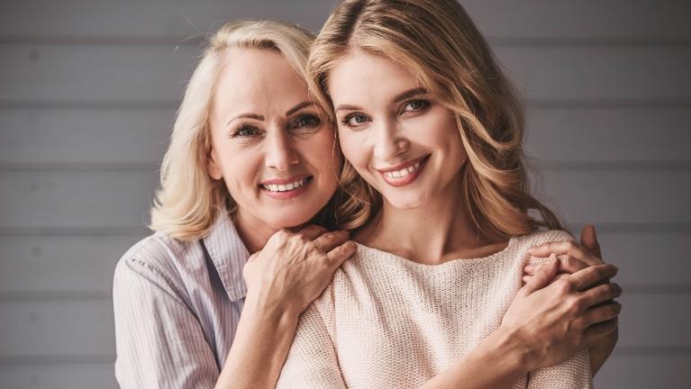 mother and daughter smiling