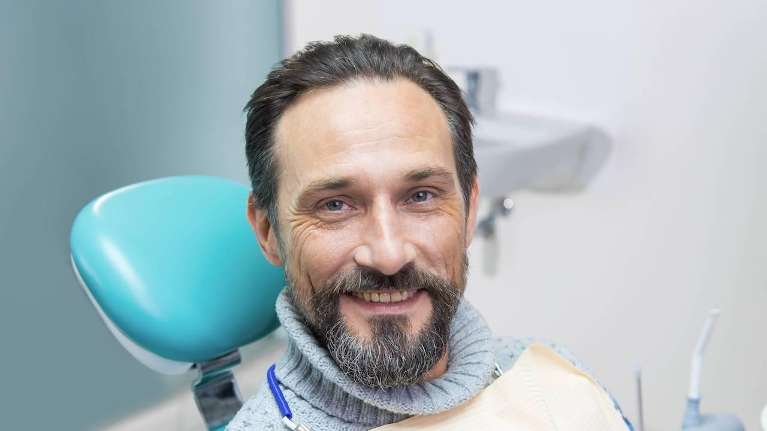 man sitting in a dental chair