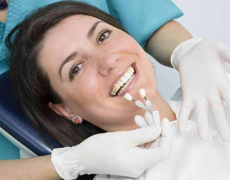 woman getting teeth whitening