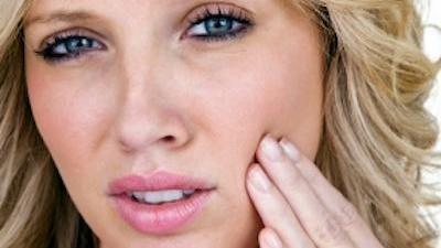 woman with sore jaw