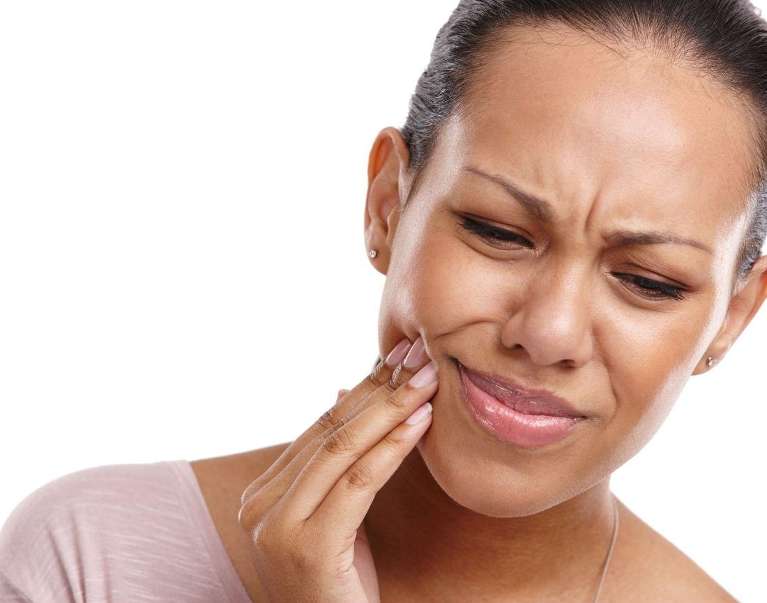 woman experiencing dental pain