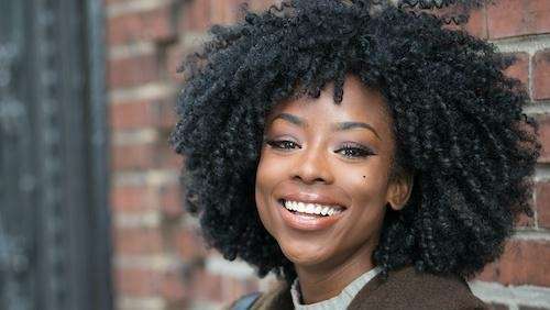 woman smiling after getting teeth whitening in winston-salem
