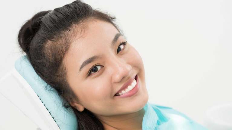 woman sitting in a dental chair