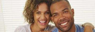 couple with perfect teeth smiling