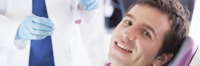 man smiling in dental chair