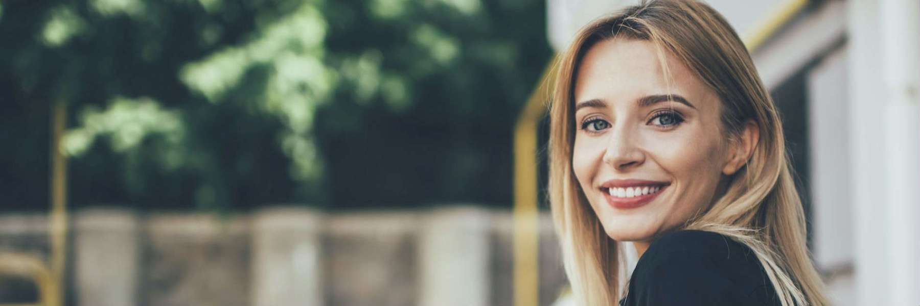 Woman smiling with dental crowns Winston-Salem NC