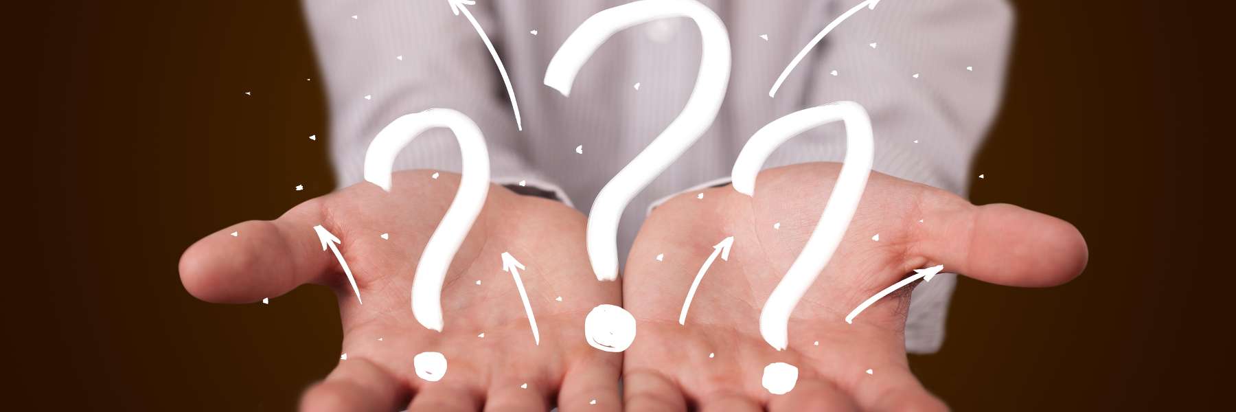 person holding illustrated question marks